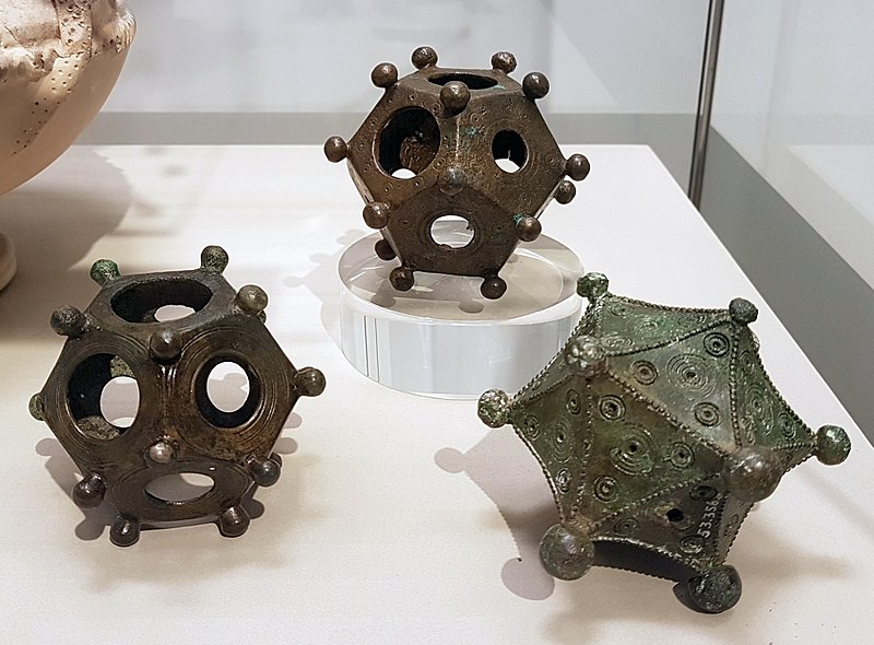 Two dodecahedra and an icosahedron on display in the Rheinisches Landesmuseum