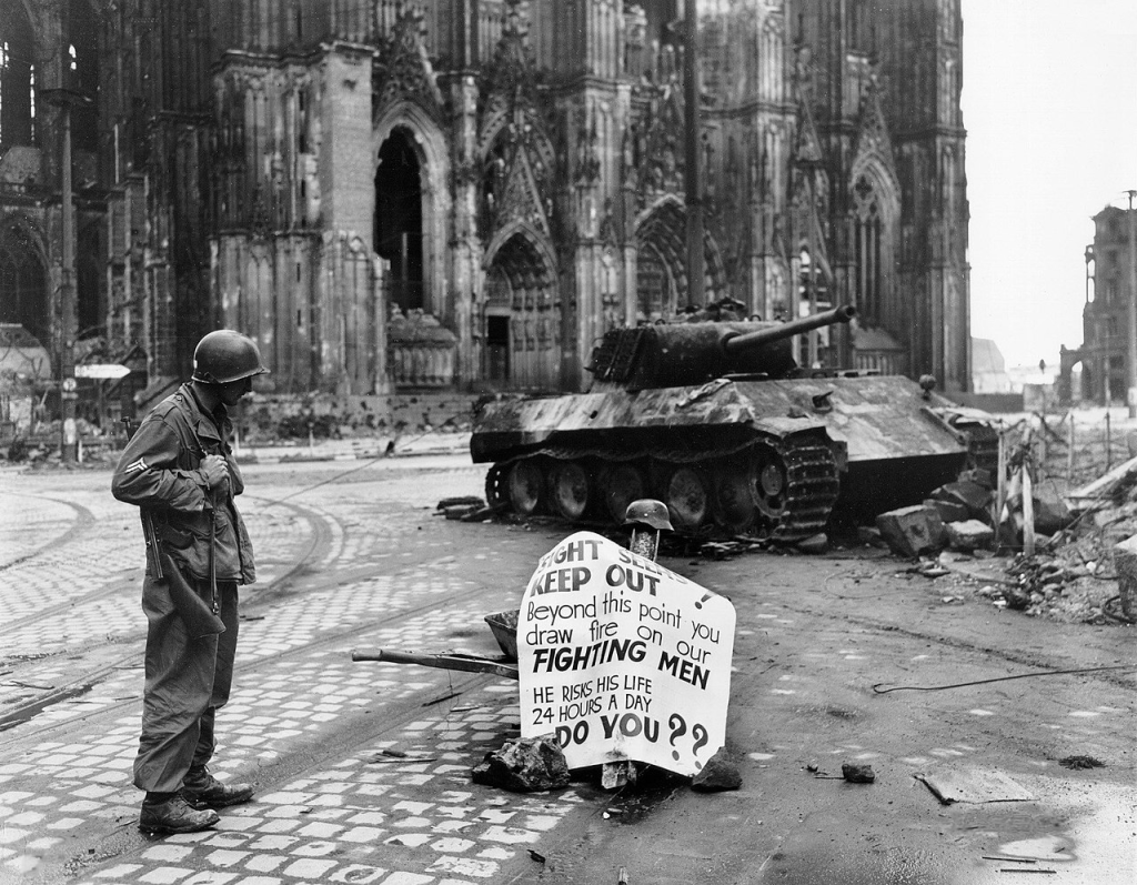US soldier and destroyed Panther tank, 4 April 1945 near cathedral