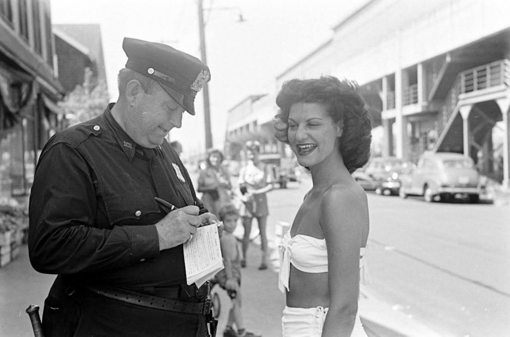 Officer is ticketing the "indecent exposure"