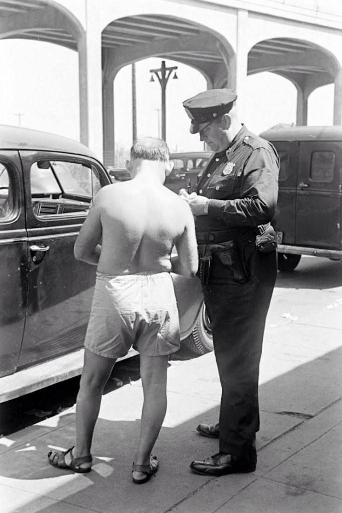 Officer is ticketing the "indecent exposure"