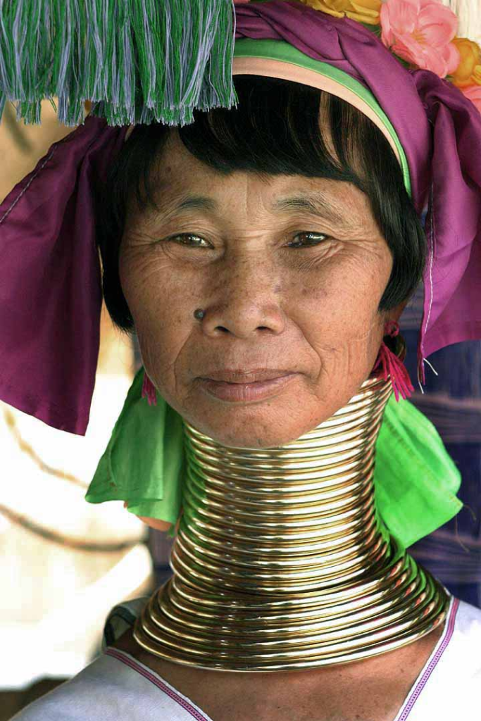 In Thailand, a Kayan (Padaung) woman (one of the Giraffe Women) proudly showcases her neck rings, demonstrating the cultural practice she embraces.