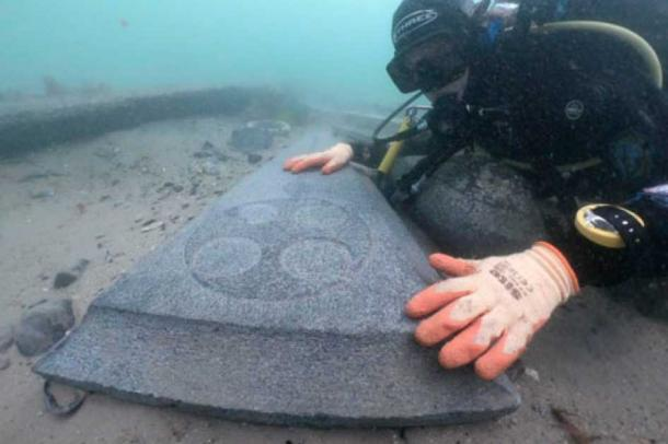 One of the two impeccably preserved Purbeck marble gravestones, resting undisturbed on the seabed, showcases a wheel-headed cross, representing an early 13th-century design. England’s Oldest Known Shipwreck Found